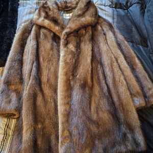 This is a vintage real fur coat.